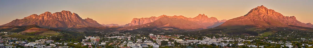 Stellenbosch and its surrounding mountains in golden evening light